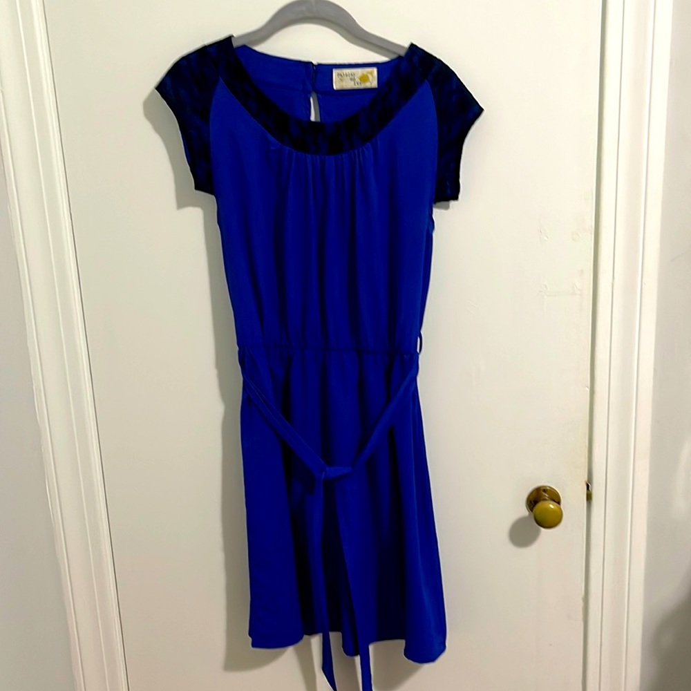 Late, blue dress with floral black lace.
